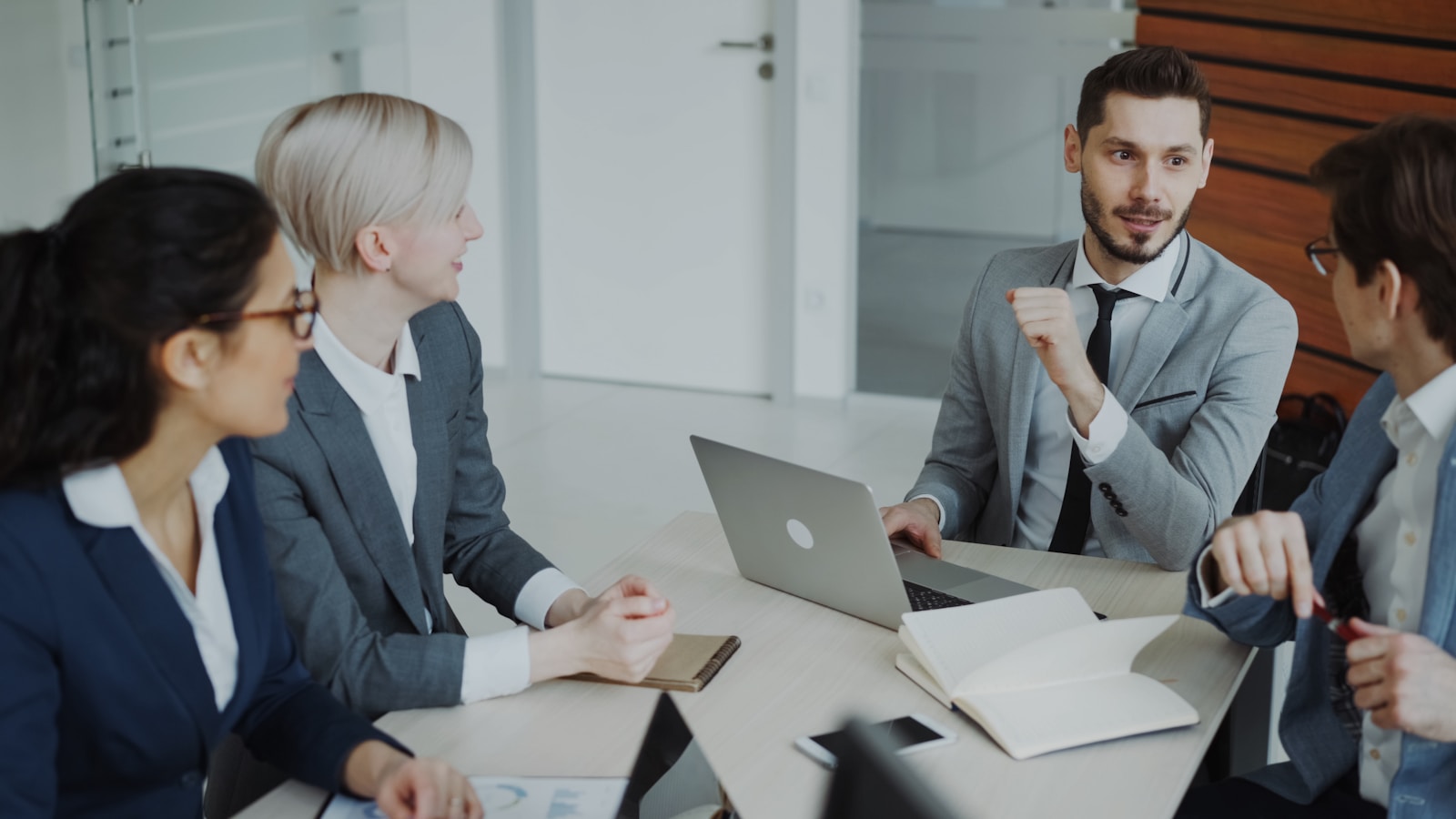 Professionals in a work meeting inside a modern office