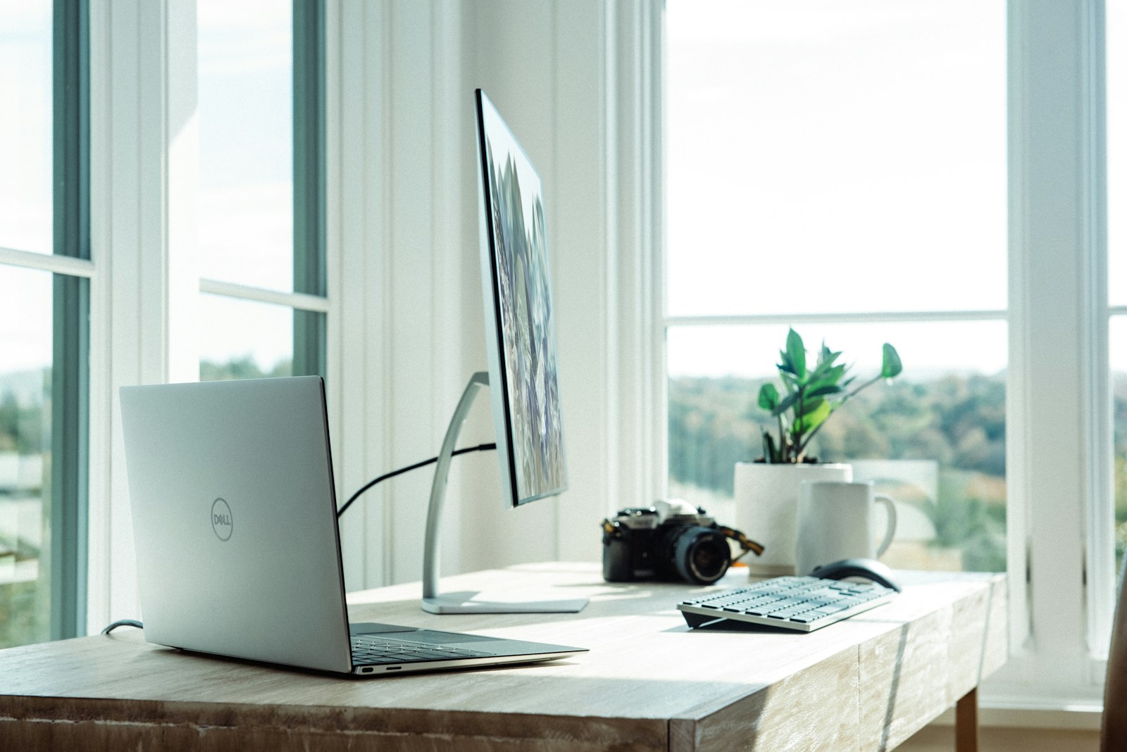 Minimalist desk with a laptop in a structured workspace